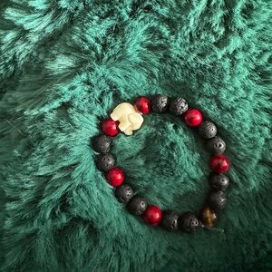 Lava rock, red quartz, tiger eye and Larimar elephant beaded bracelet